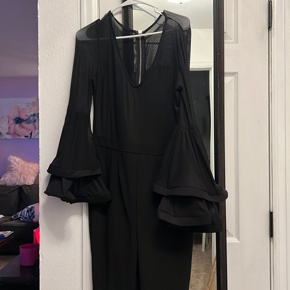 Brand new jumpsuit black size medium very cute , was a little big on me